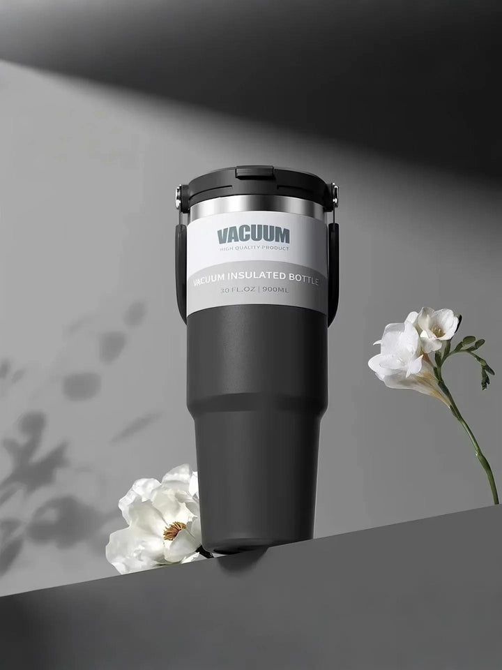 MyLaEvo black bottle in black floral minimal space, low-angle view