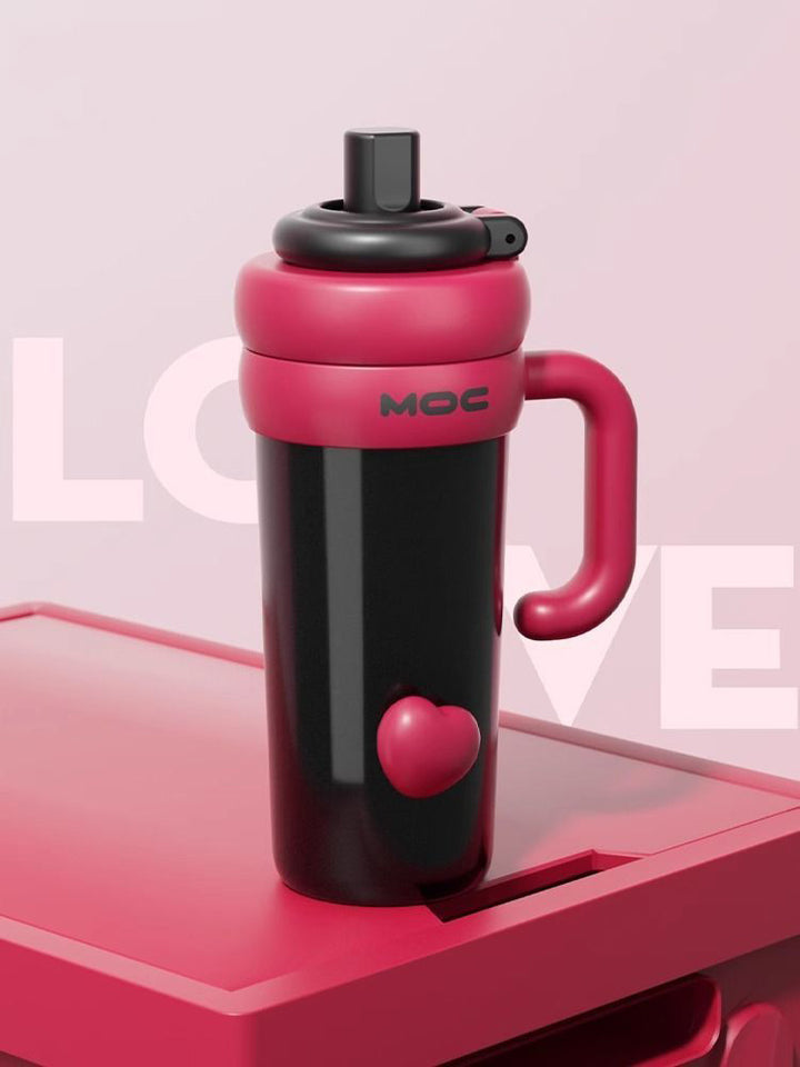 MyLaEvo black bottle with red handle and heart accent on red plate with pink love theme