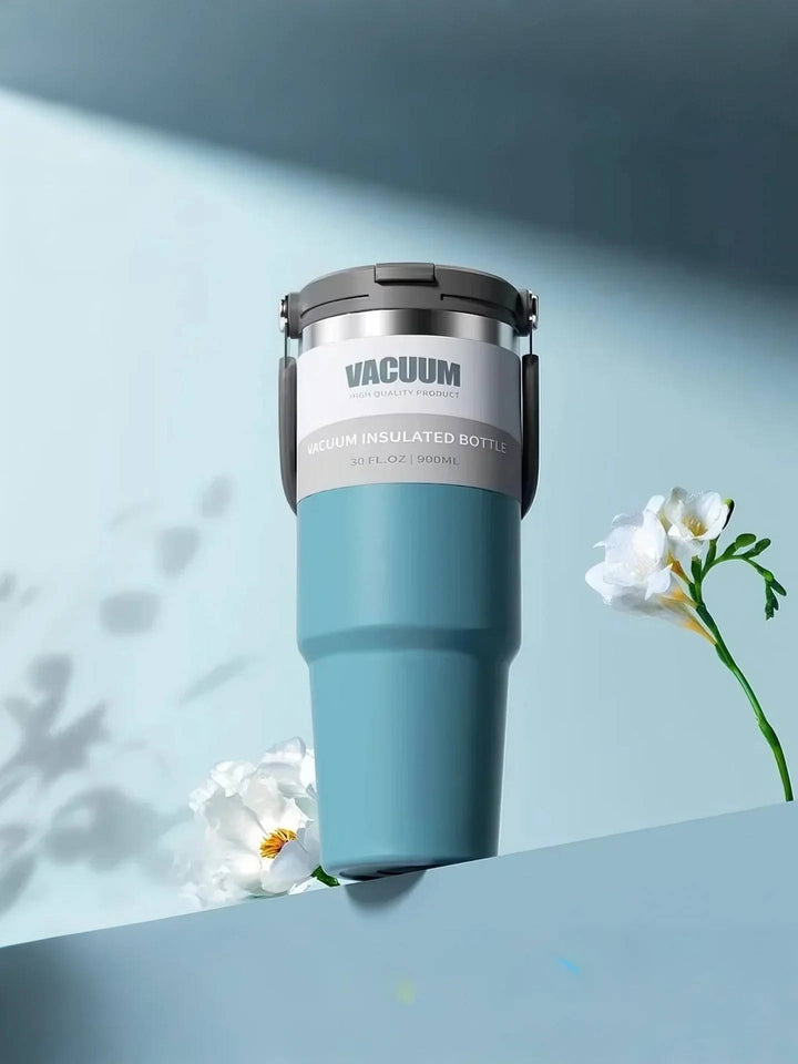 MyLaEvo blue bottle in minimalist blue floral setup, low-angle perspective