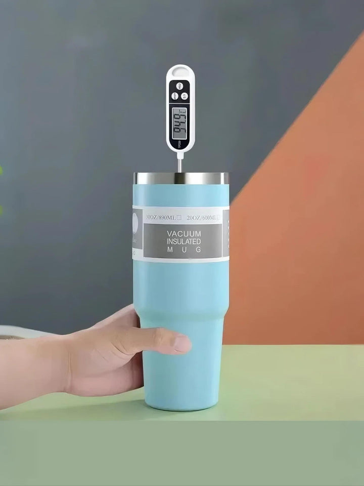 Hand checks MyLaEvo blue bottle temperature using thermometer in bold background