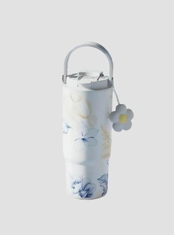 Blue Lily tumbler in minimalist blue-toned setting with floral branches – MyLaEvo.