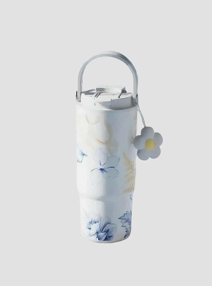 Blue Lily tumbler in minimalist blue-toned setting with floral branches – MyLaEvo.