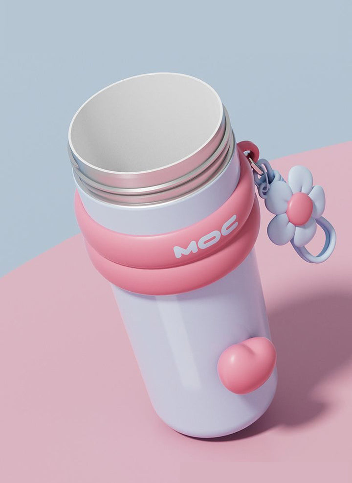 MyLaEvo light blue bottle with pink accents showing ceramic lining inside on pastel background