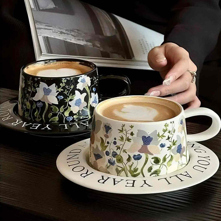 White vintage ceramic cups with latte coffee on elegant desk, luxury coffee table setup