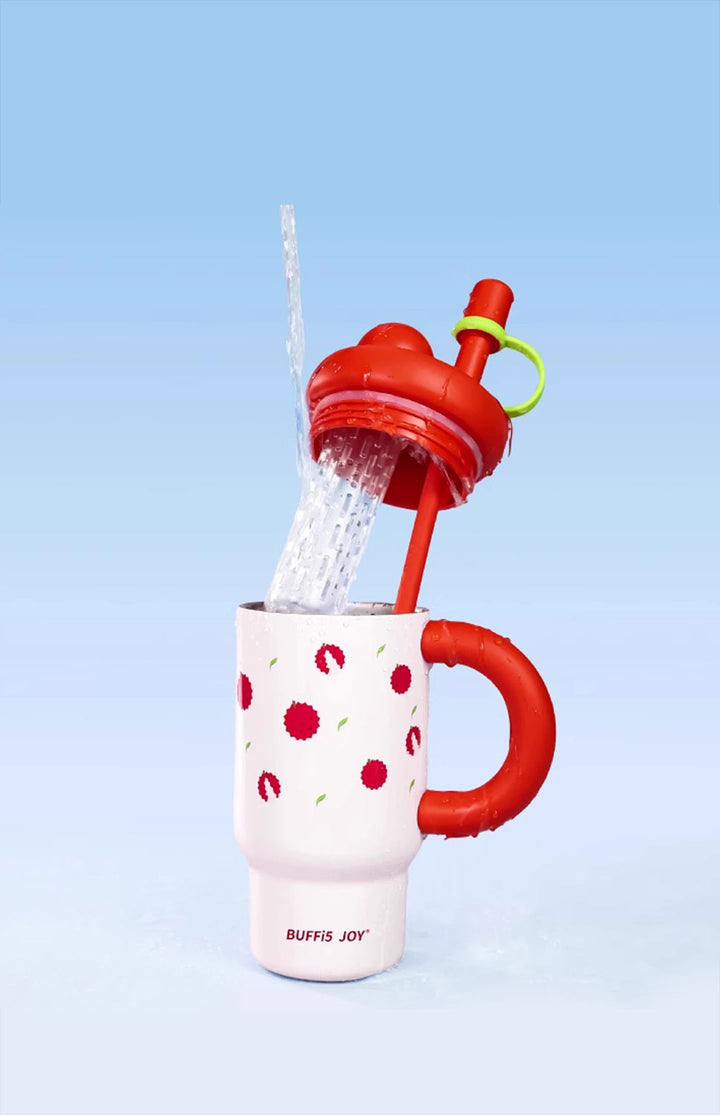 Red lychee print bottle pouring water with lid open, vibrant and insulated hydration style