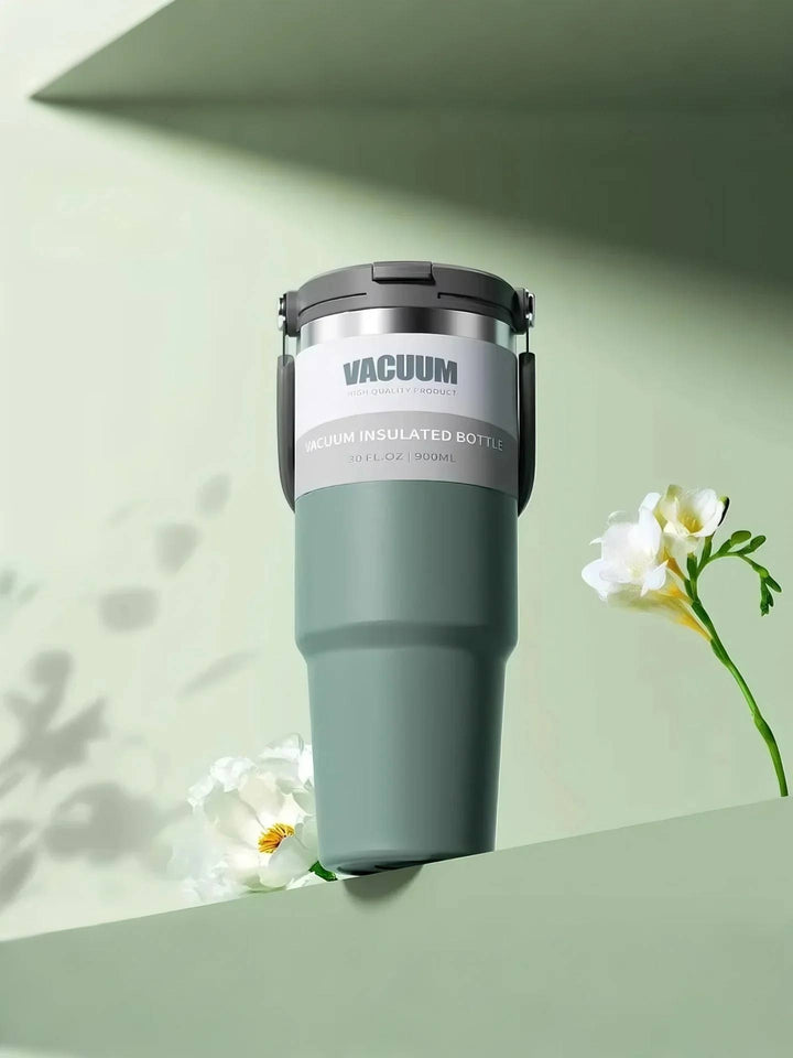 MyLaEvo green bottle in green minimalist setting with white flowers