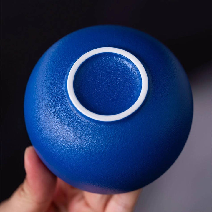 Close-up of Klein blue ceramic coffee cup back, showing elegant refined craftsmanship