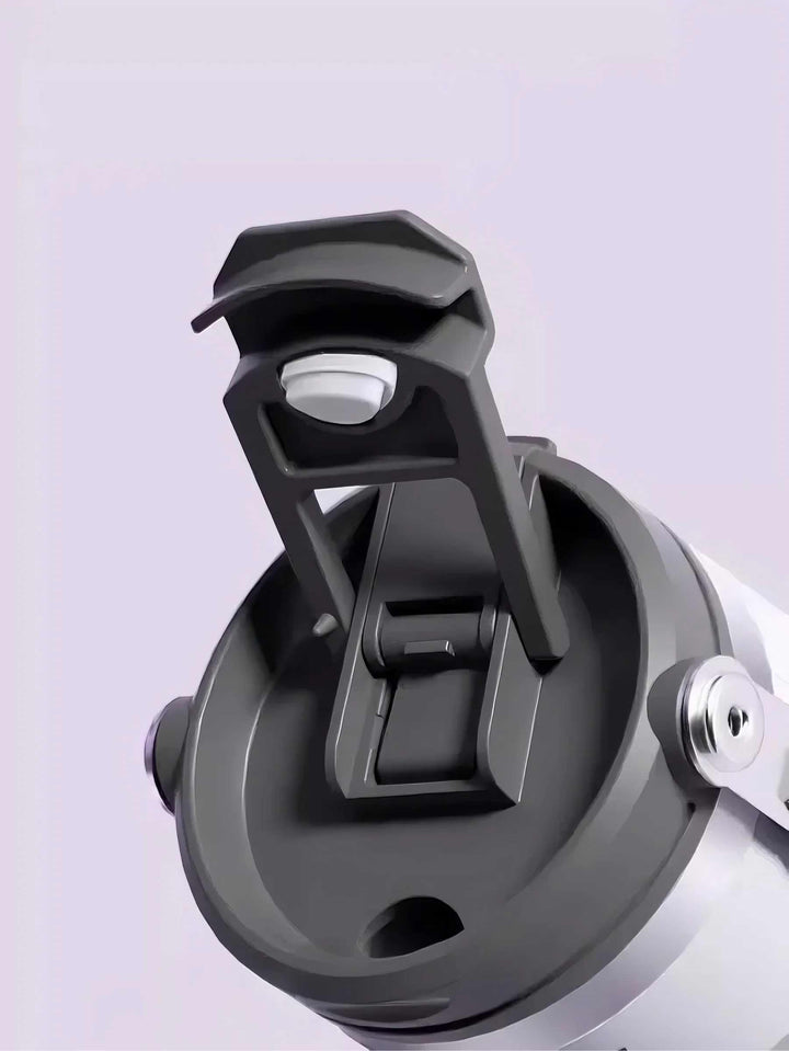 Close-up of MyLaEvo lid showing straight-drink spout against purple backdrop
