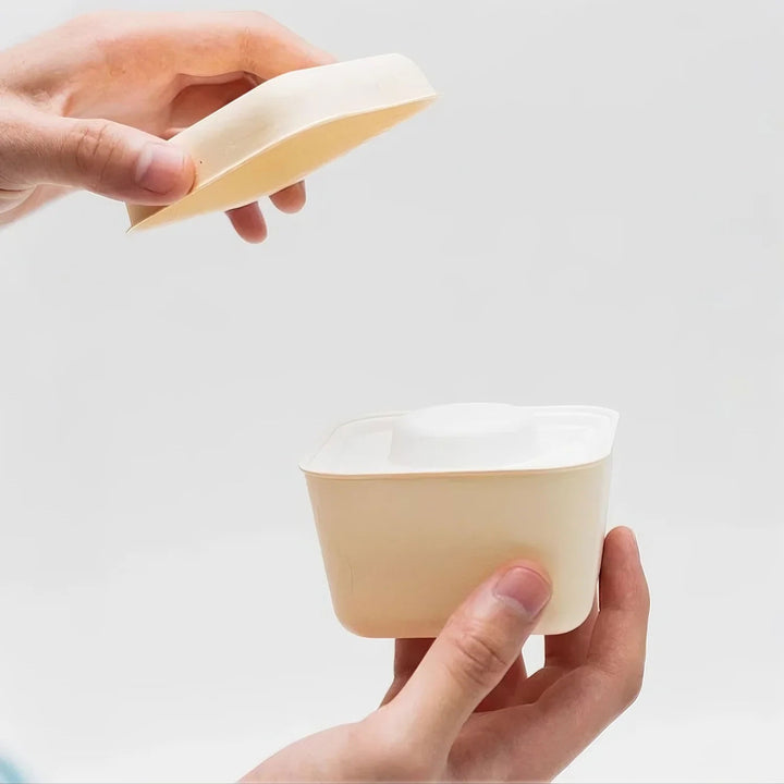 Elegant moment of cream yellow product opened, showcasing refined design and smooth functionality.