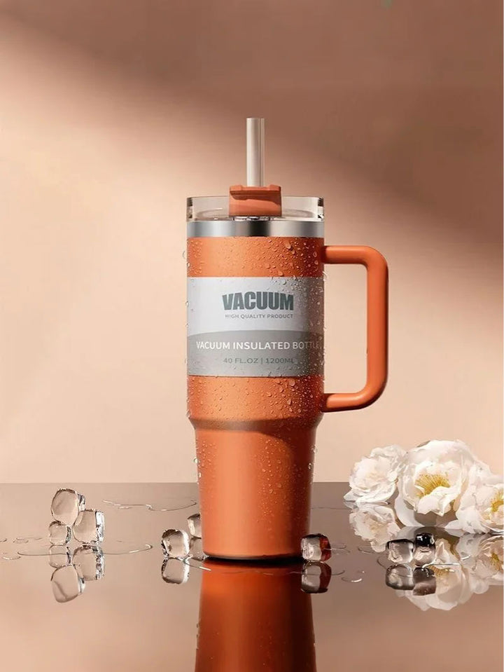 MyLaEvo orange bottle with icy water beads and flowers in orange minimal setup