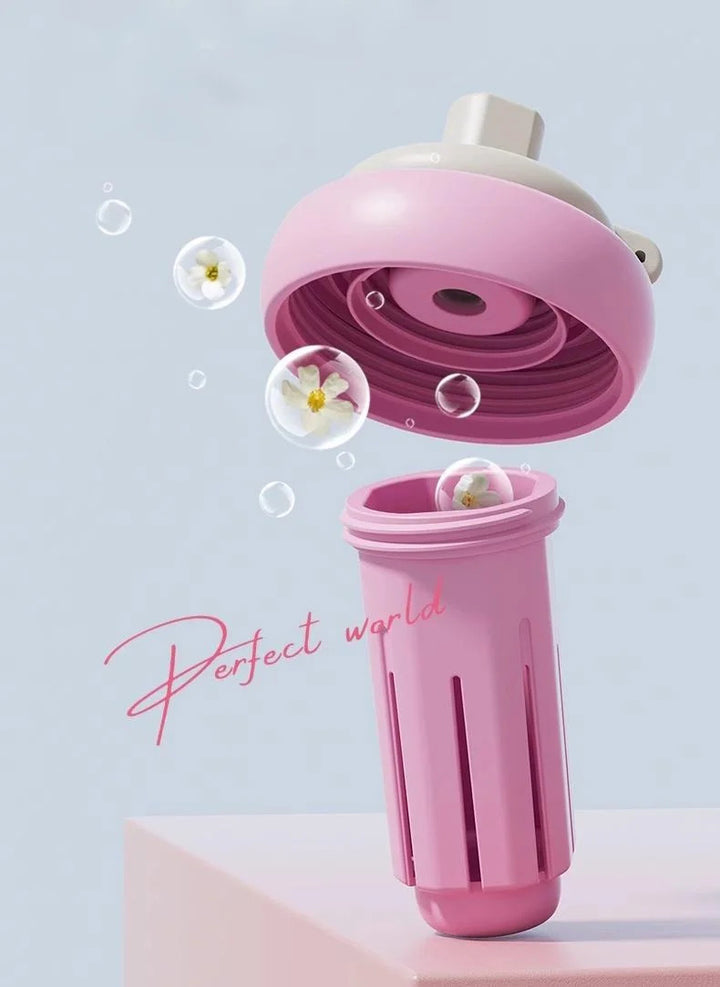 MyLaEvo pink tea infuser releasing floral aroma in minimalist scene