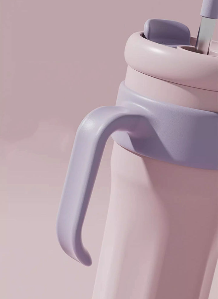 MyLaEvo pink bottle with lavender handle on pink background, highlighting soft-tone contrast