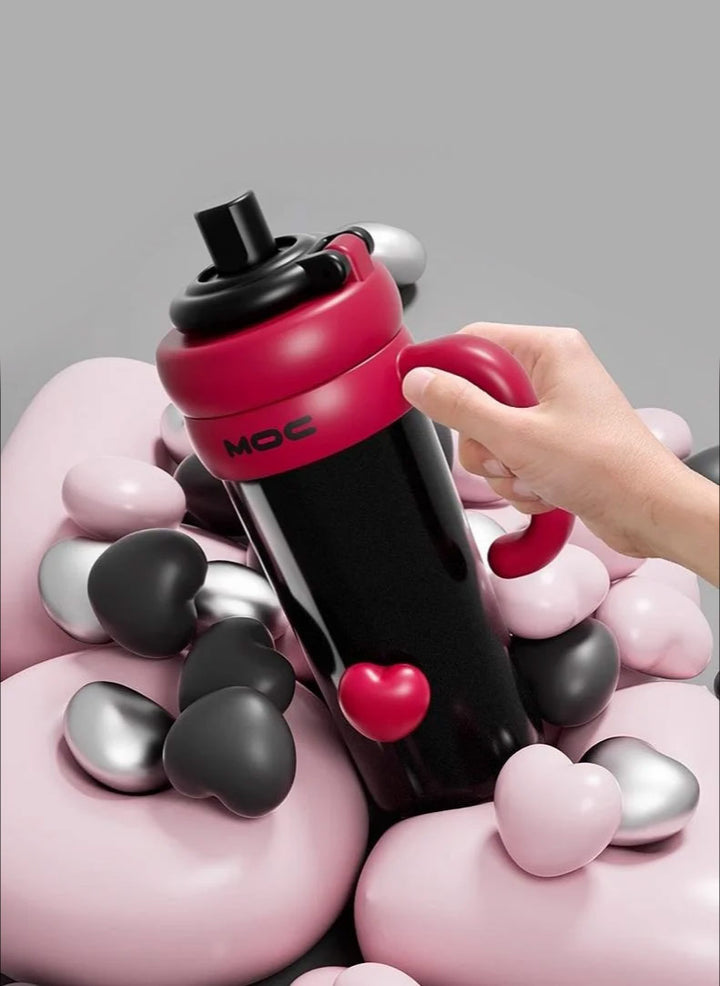 Hand pulling black bottle from pink heart container, symbolizing emotional connection