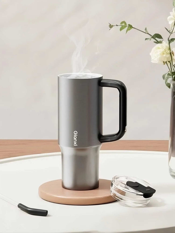 Silver tumbler in different home scenes with open lid and visible steam – MyLaEvo.