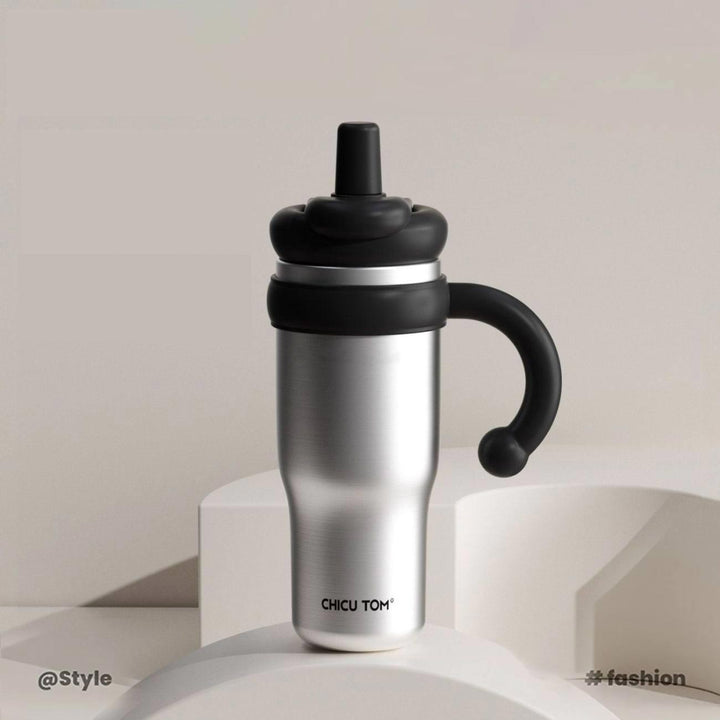 MyLaEvo raw steel bottle with black accents displayed in pure white minimalist space