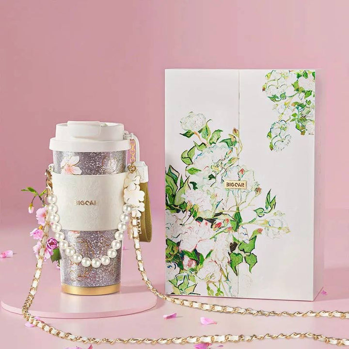 MyLaEvo natural titanium cup with pearl strap and gift box, pink floral background