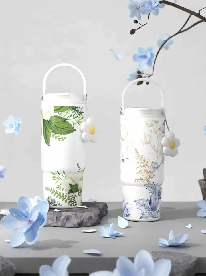 Two flower tumblers displayed in minimalist setting with soft floral styling – MyLaEvo.