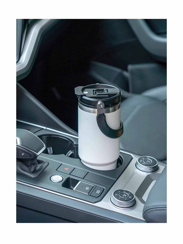 MyLaEvo white water bottle in car cup holder, showing everyday use