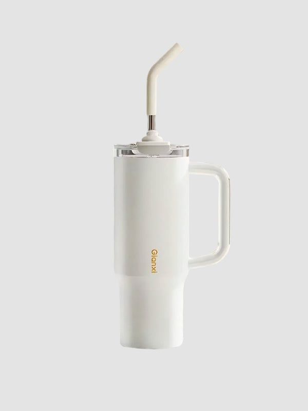 White tumbler being dropped on stone surface, demonstrating durability – MyLaEvo.