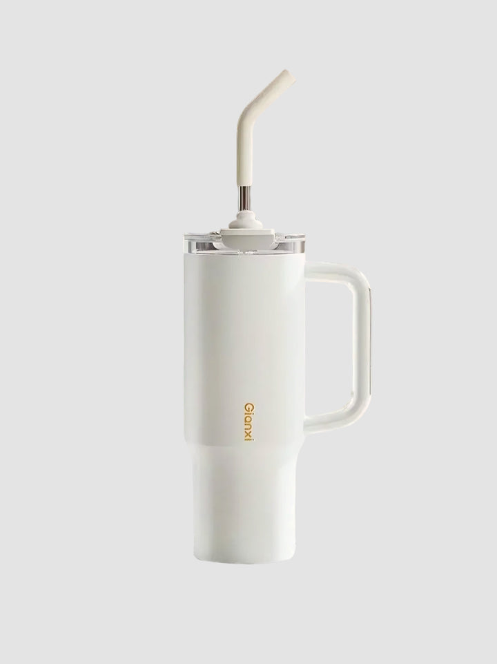 White tumbler being dropped on stone surface, demonstrating durability – MyLaEvo.