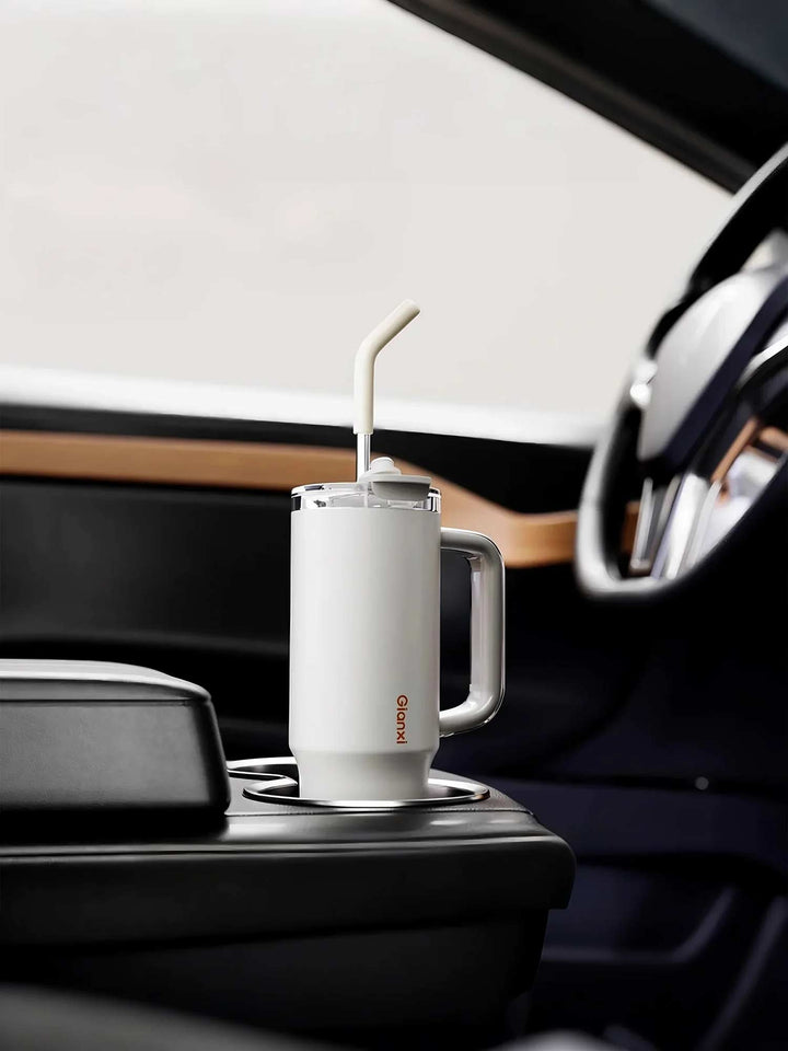 White tumbler placed in car cup holder, ideal for travel – MyLaEvo.