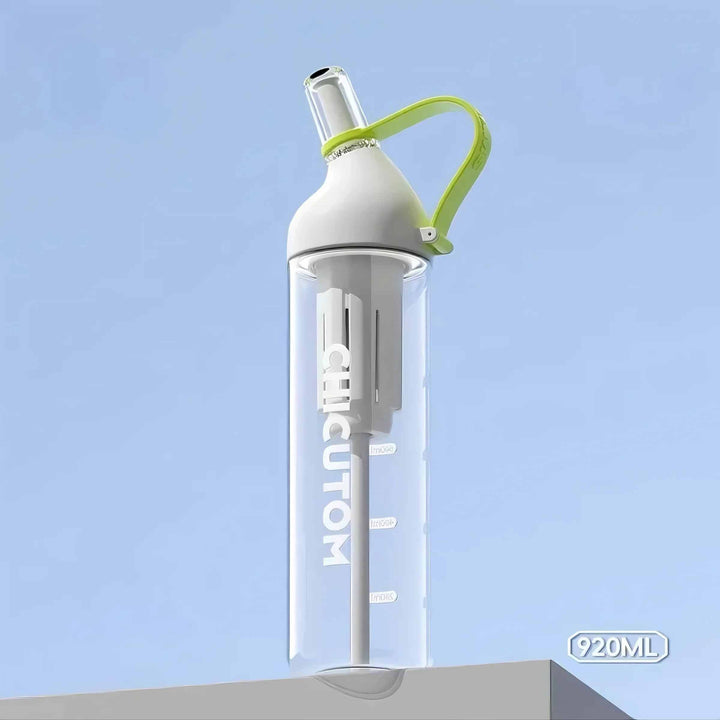 White water bottle on white surface with light green strap against blue background, highlighting soft contrast.
