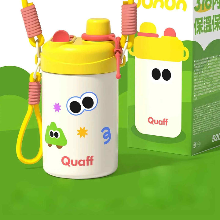 White insulated bottle with yellow lid, red decoration, cute sticker, and strap on green background.