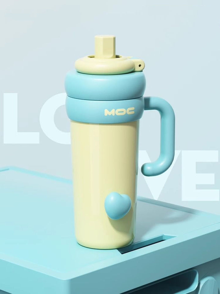MyLaEvo soft yellow bottle with sky blue handle and heart on blue plate, pastel setup