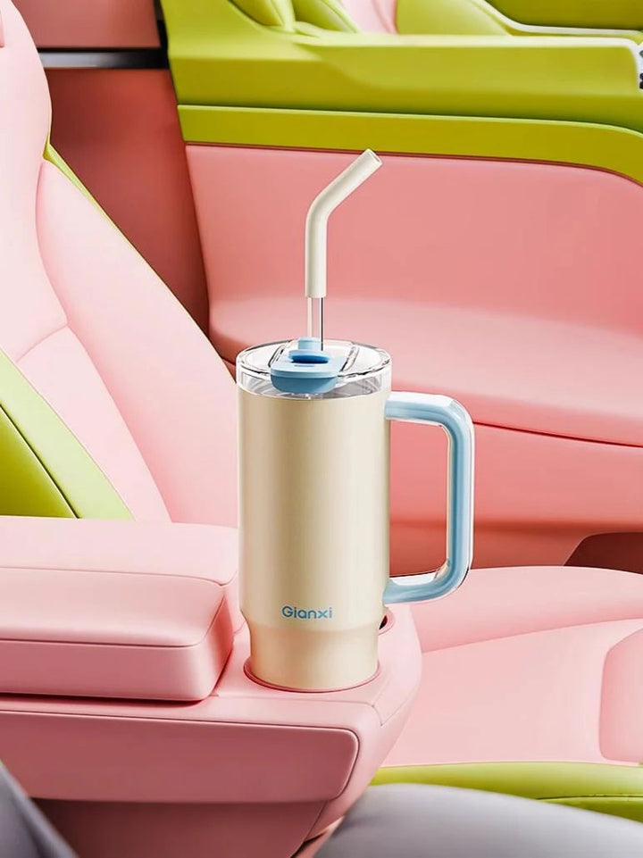 Yellow tumbler in car cup holder with pink-green interior, feminine vibe – MyLaEvo.