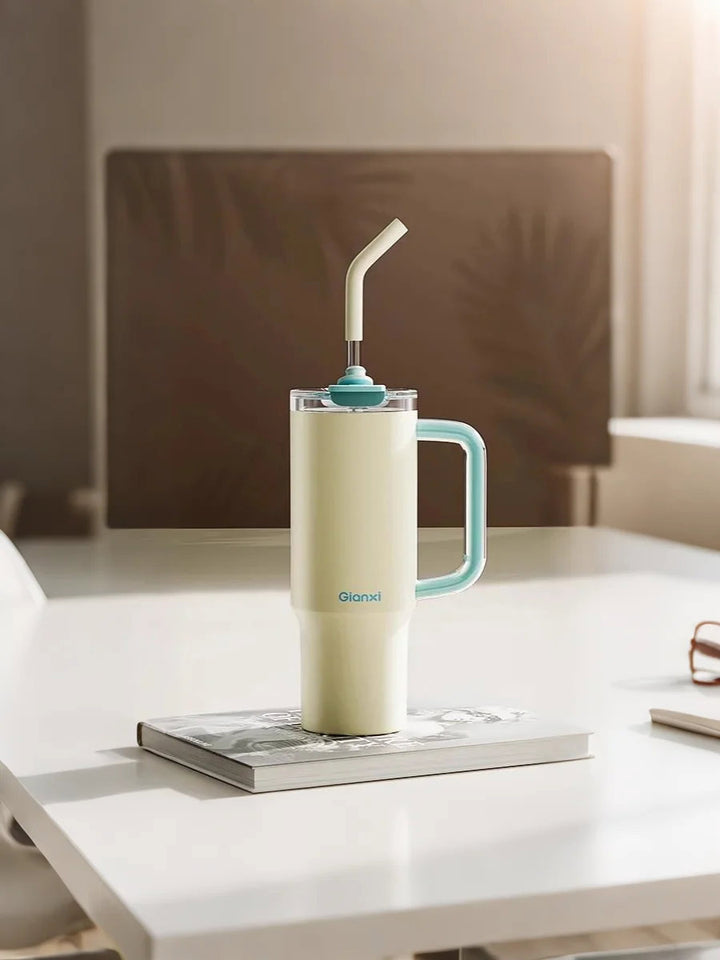 Yellow bottle on desk with open books and daily essentials – MyLaEvo.