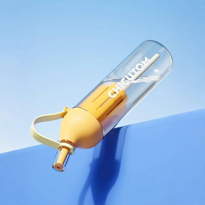 Yellow product upside down on blue background, highlighting its leakproof design and secure seal.