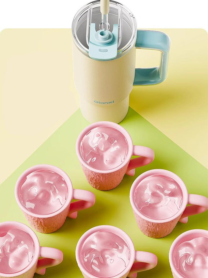 Top view of yellow tumbler surrounded by pink cups, showing water volume equivalent – MyLaEvo.